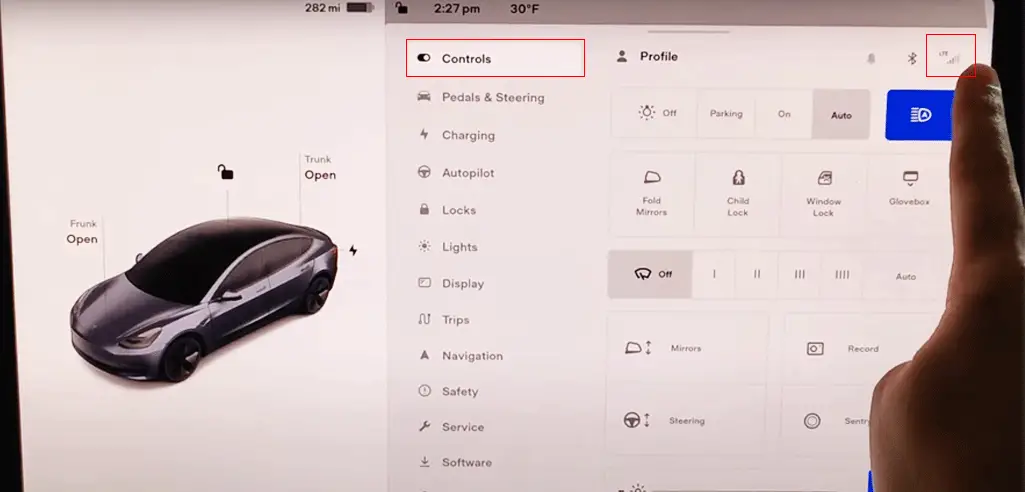 Connect your Tesla to a stable Wi-Fi network.
Access the Tesla Settings menu on the touchscreen.