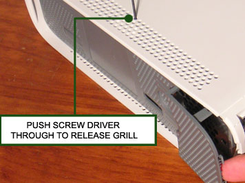 Place the Xbox 360 console on a clean, flat surface.
Use a small screwdriver or a plastic opening tool to remove the plastic grille covering the fan.