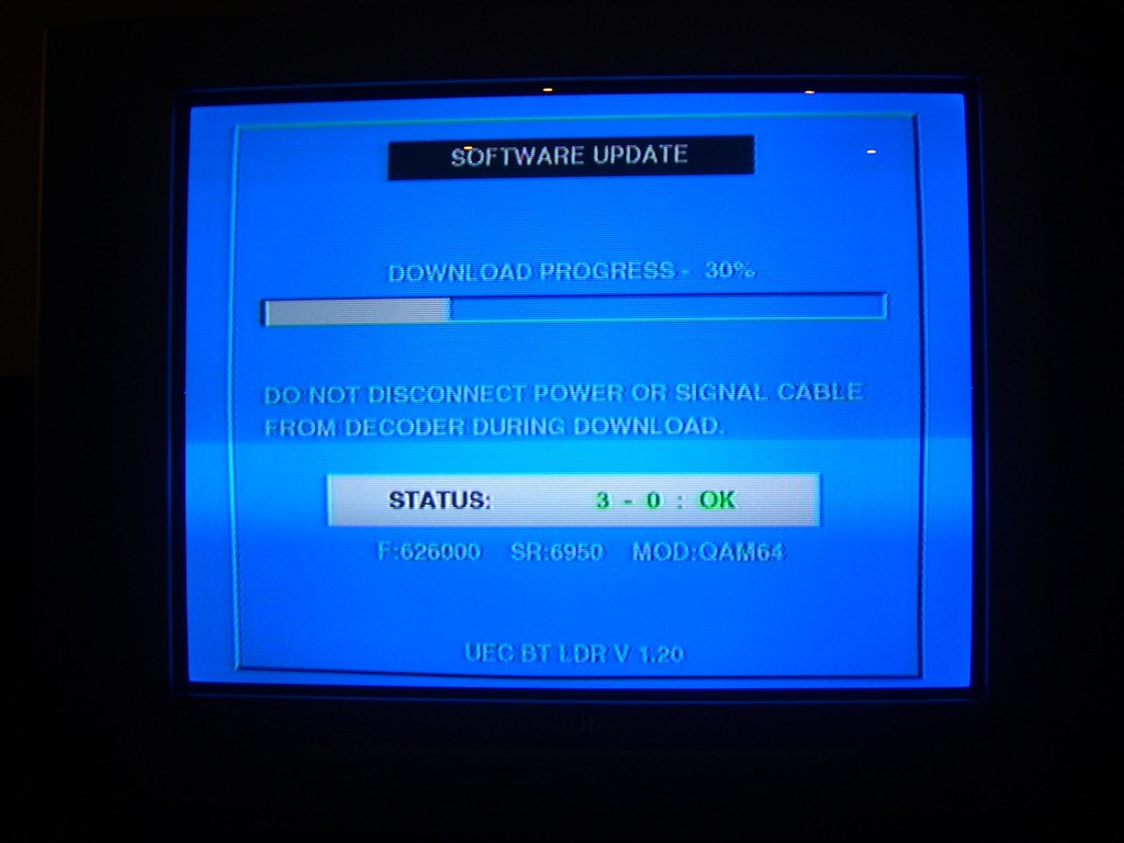TV screen displaying firmware update progress